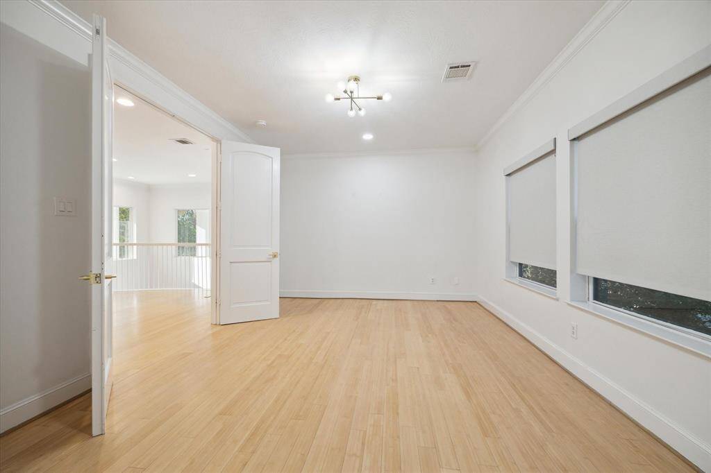 Upstairs second primary bedroom suite.