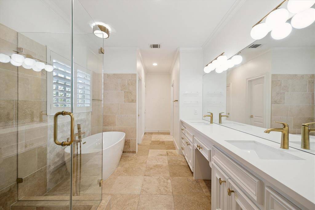 Second floor primary bathroom.  Nice-size with dual sinks, knee space.
