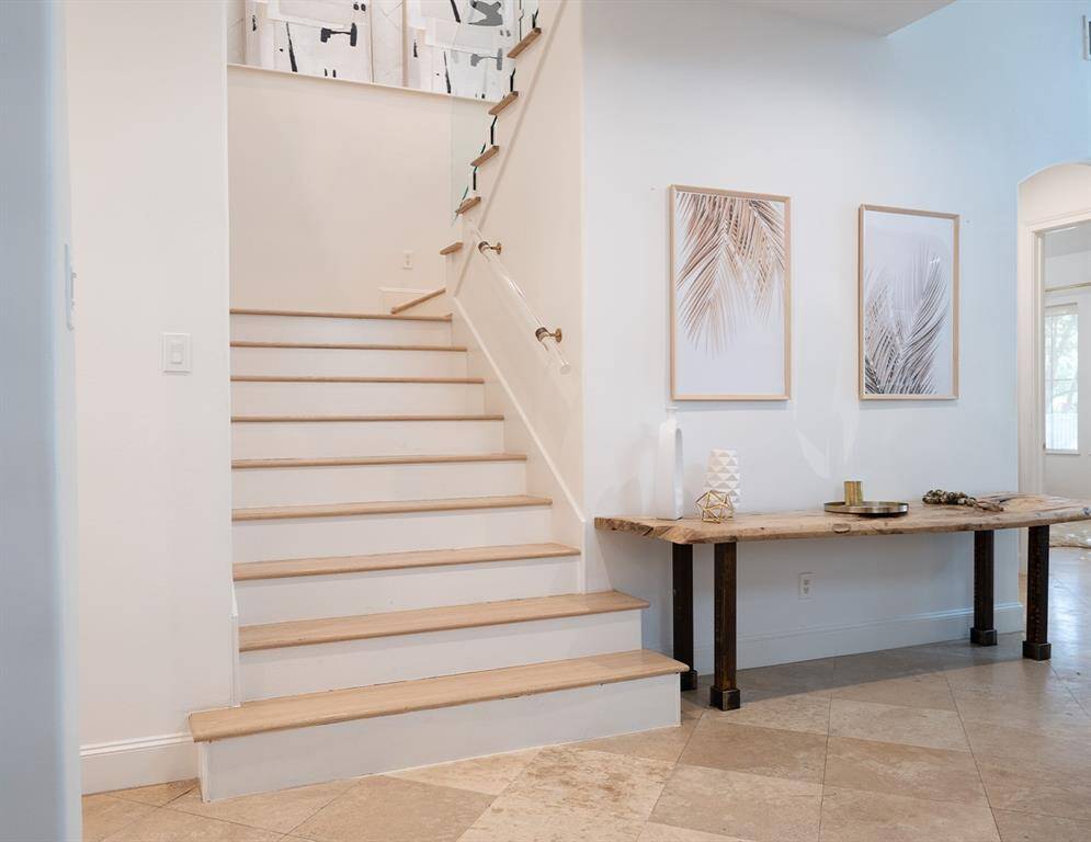 Enter into a well-lit, two story foyer.