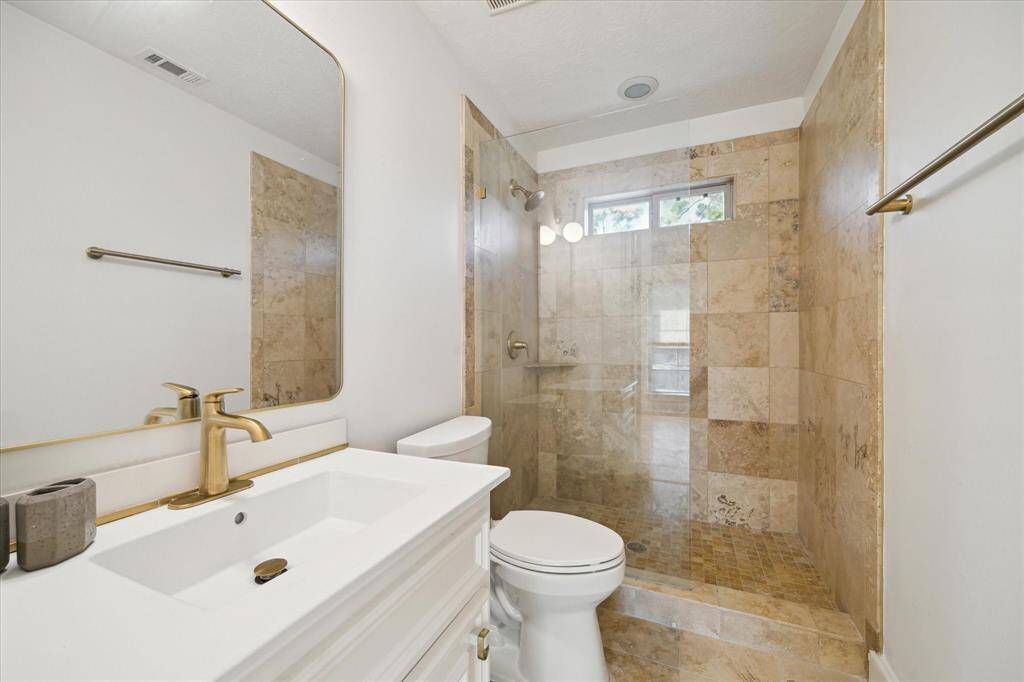 Garage apartment bathroom with walk-in shower.  Large, walk-in closet with built-ins.
