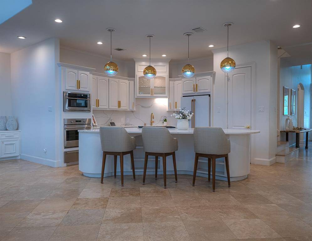 Large island is perfect for casual dining and seamless into the two story great room.  Everyone will gather here!