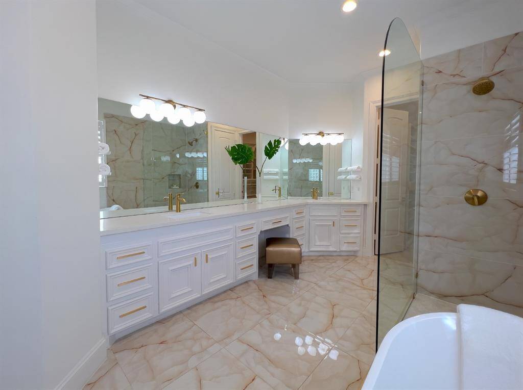 Plenty of storage and knee space for dressing.  Two walk-in closets with closet systems built in for maximum organization.  One of the closets has even additional storage space discreetly tucked behind a secret access.
