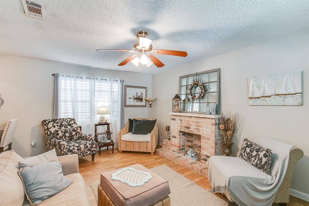 This is a previous photo of when home was occupied. Staged, flooring has been changed.