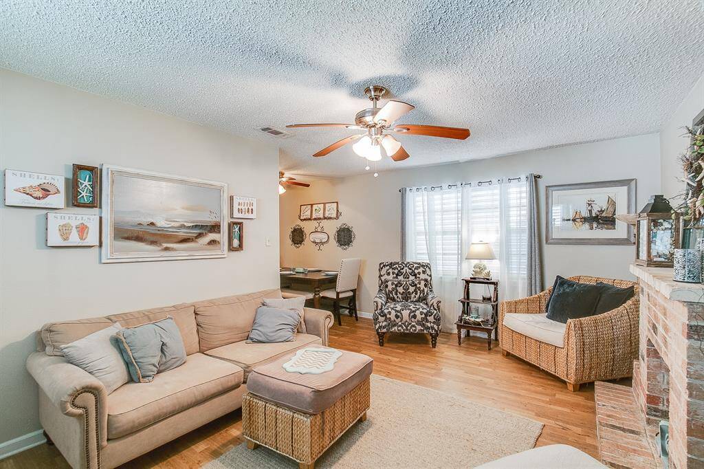 This is a previous photo of when home was occupied. Staged, flooring has been changed.