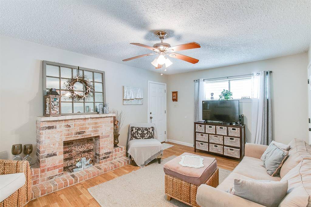 This is a previous photo of when home was occupied. Staged, flooring has been changed.