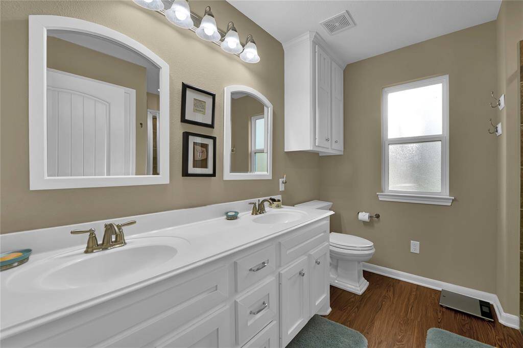 Primary bath with dual vanities.