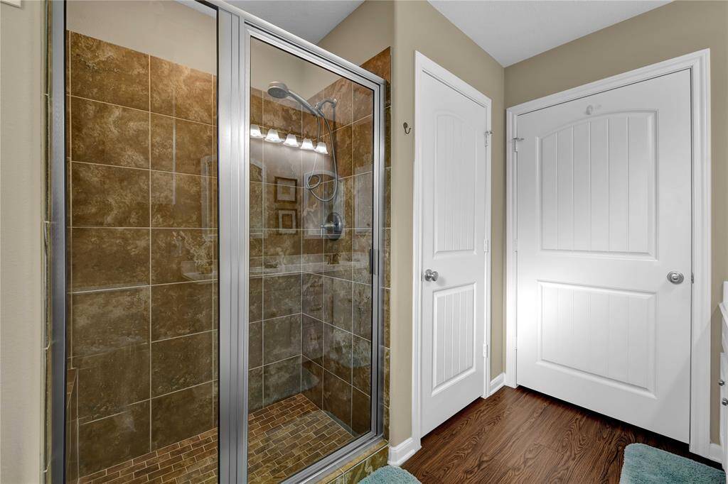 Oversized tile shower in the primary.
