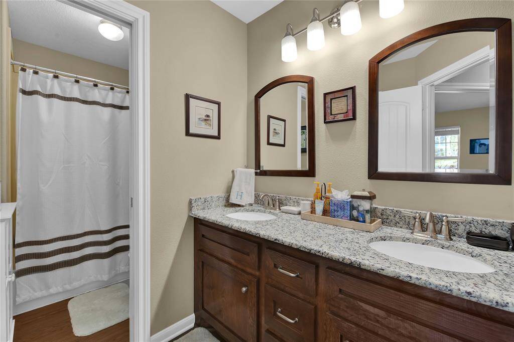 Guest bath with dual sinks.