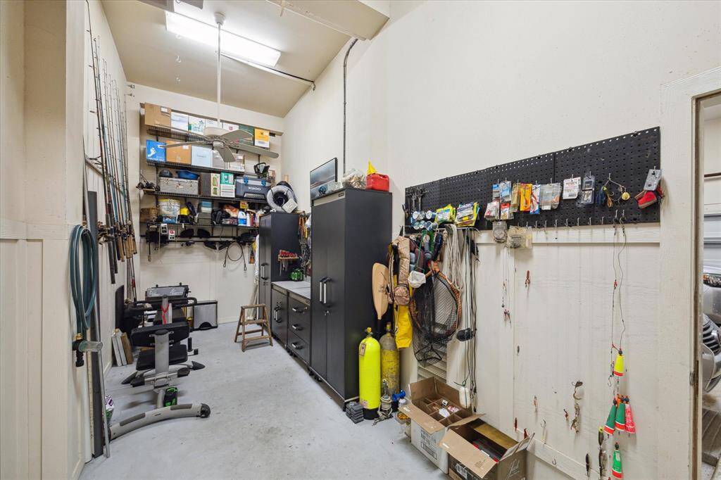 This workshop, located on the ground floor off the garage, offers plenty of space for storage and various projects.