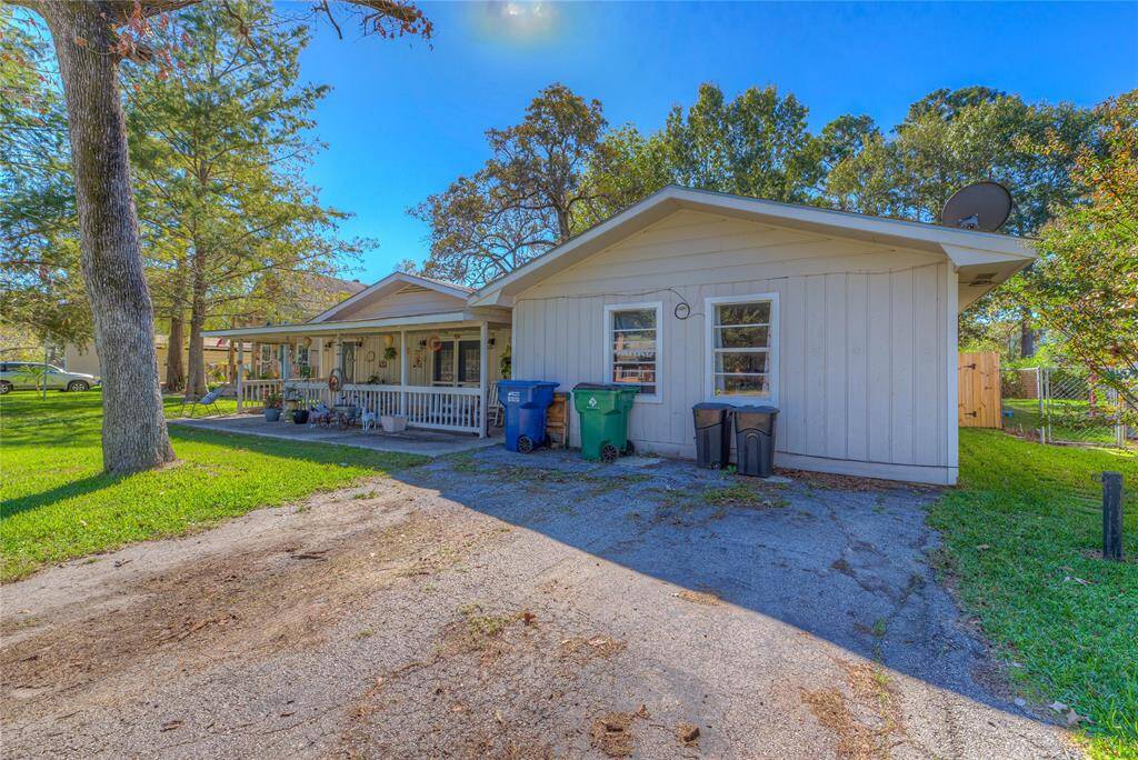 The front of the house with a 2 car wide driveway
