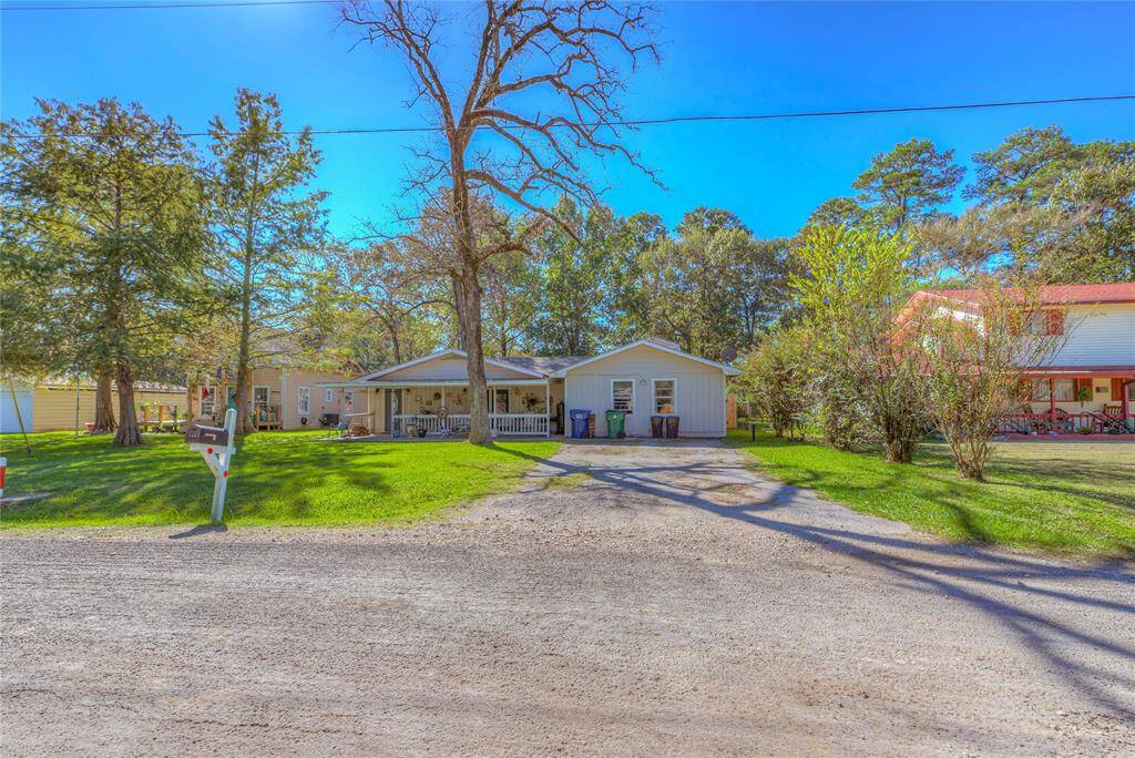 The front of the house with a 2 car wide driveway