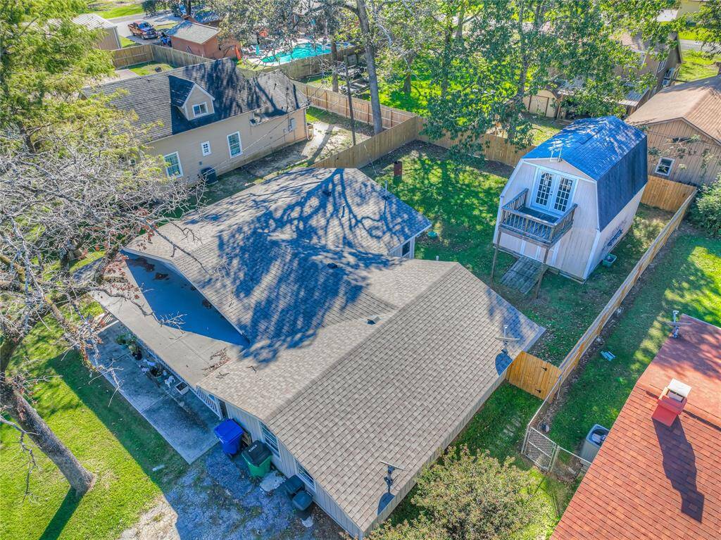 Ariel view of property showing the storage building in the fenced in backyard