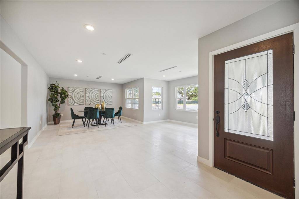 Beautiful, wide open spaces - This view showcases the formal living and dining room. Hard surfaces throughout the entire home - no carpet.