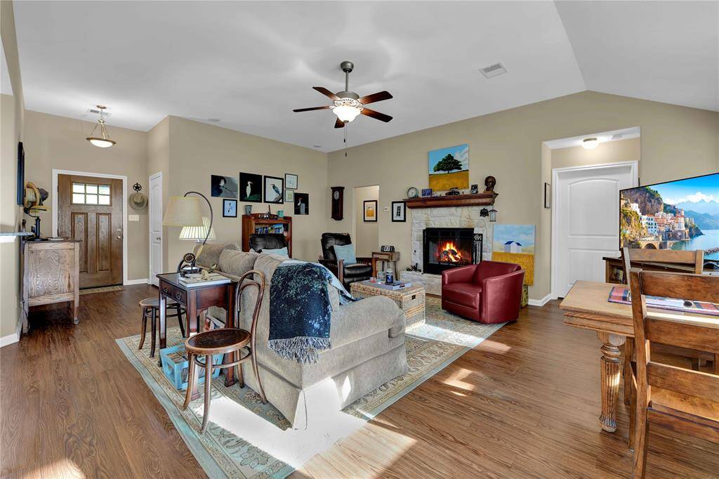 View from Dining area. High ceilings, gas fireplace, laminate flooring throughout the home.