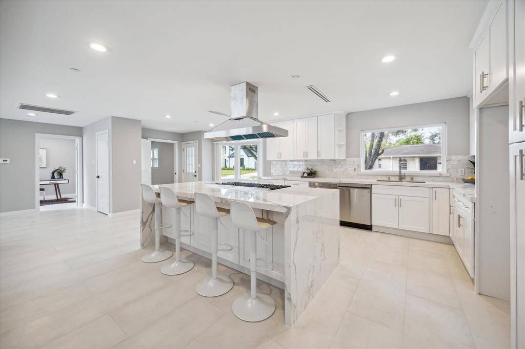 This chef's delight kitchen will be the heart of the home.  Quartz counters, stainless appliances.  Large eat-in island.
