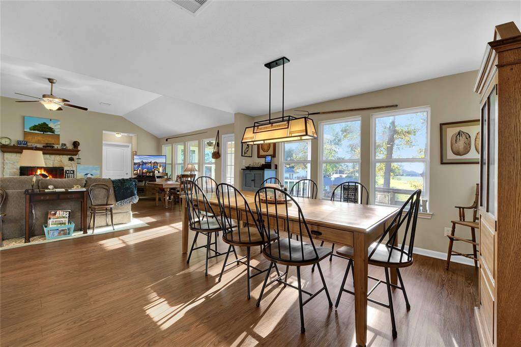 Dining area is open to kitchen and living and has large windows offering great views.