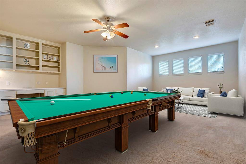 This is a RENDERING of what the upstairs Game Room would look like with furniture.