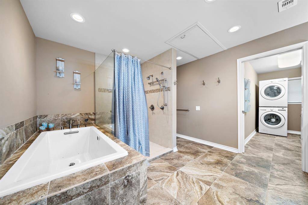 Large Tub with Separate Shower and Laundry Area