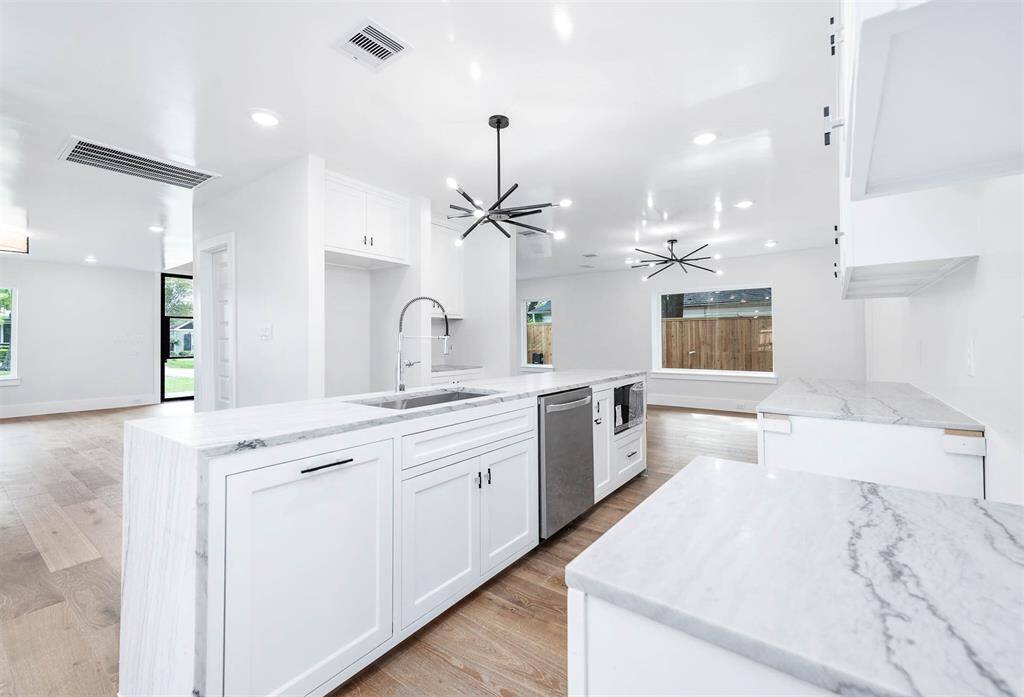 Spacious open concept kitchen kitchen with access to living and dining areas