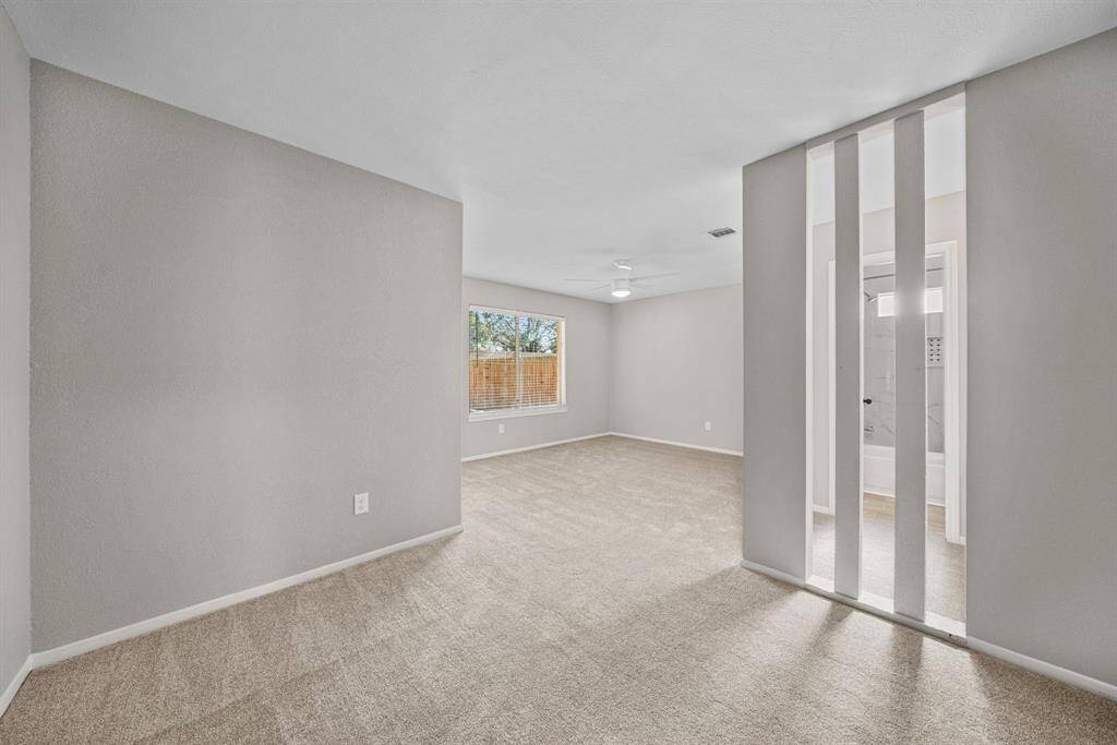 Spacious primary bedroom with sitting area.