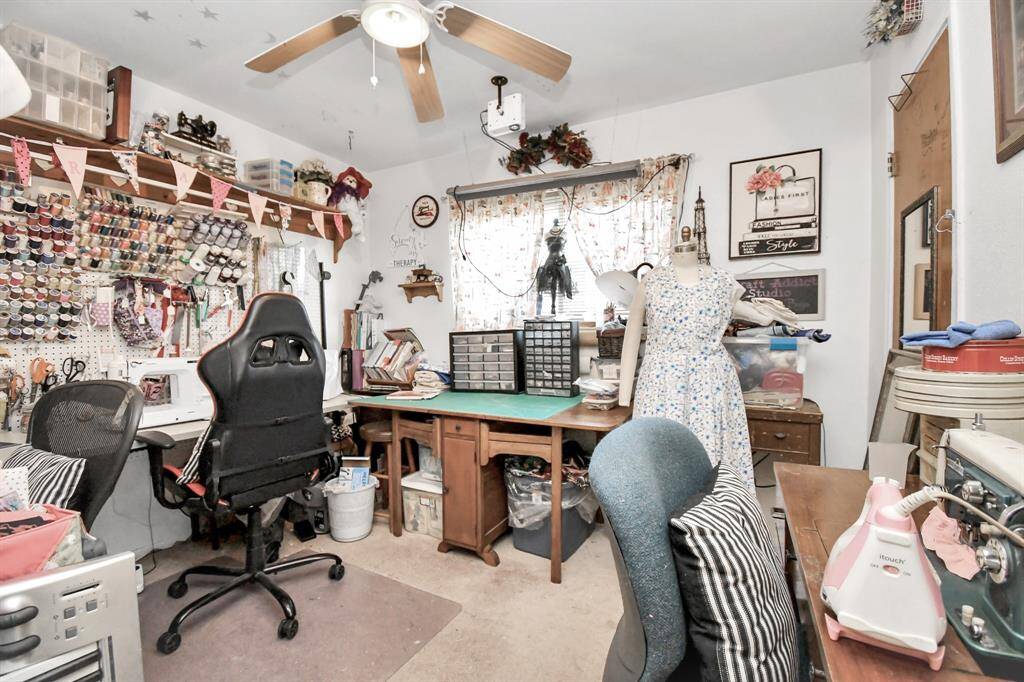 Bedroom #3 serves as a seamstress room. It features a large window and a walk-in closet.