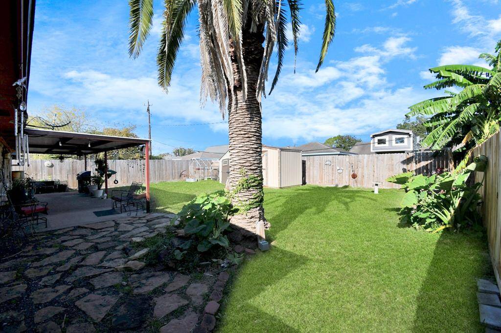 A large backyard with plenty of open space for outdoor activities. The expansive yard offers potential for gardening, entertaining, or simply enjoying the outdoors in privacy.
