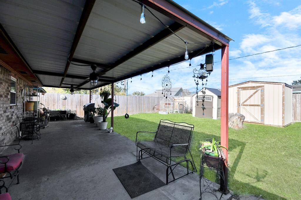 A shaded carport adds an extra touch of convenience, offering protection from the sun while still allowing easy access to the backyard. Whether you're gardening, hosting guests, or simply unwinding, this backyard is designed for both functionality and enjoyment.