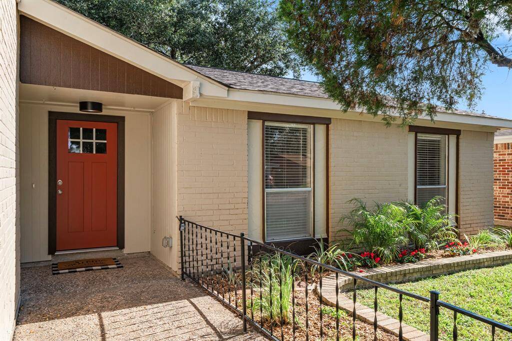 Covered front entry with new front door.