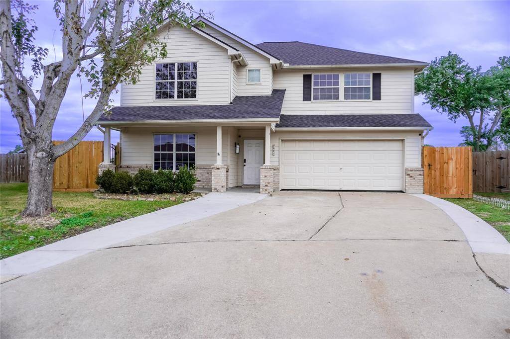 A charming two-story house with a modern exterior, featuring a spacious two-car garage and a well-maintained front yard. The driveway offers ample parking, and the fenced backyard provides privacy. Ideal for families seeking a comfortable suburban home.