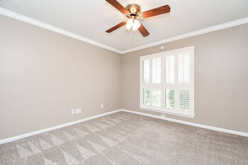 Secondary bedroom with carpet