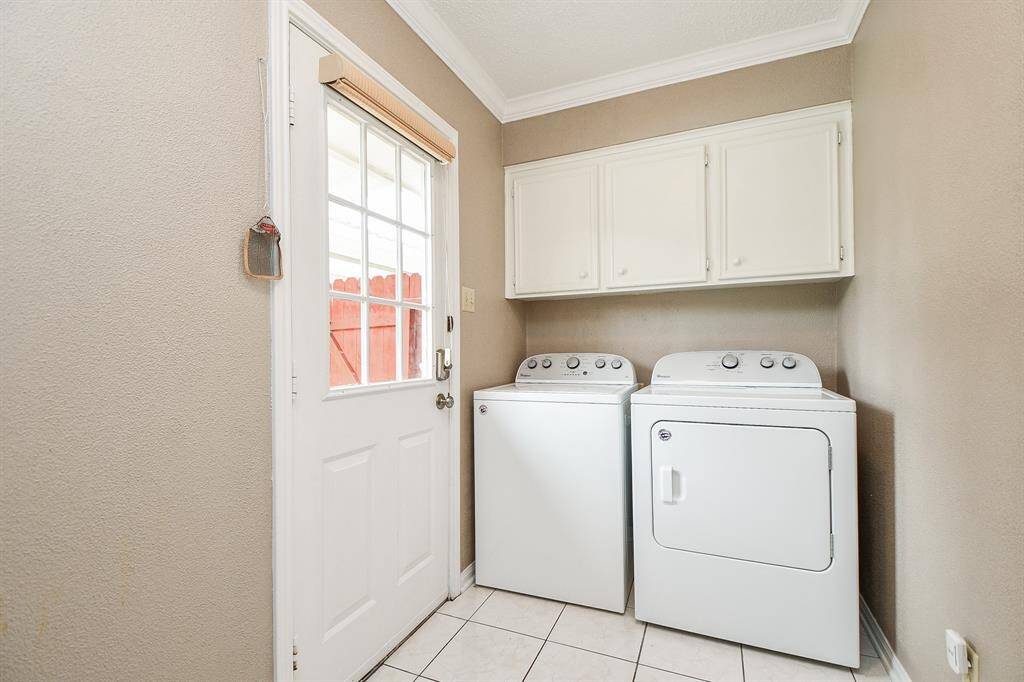 Spacious and functional utility room with ample storage.