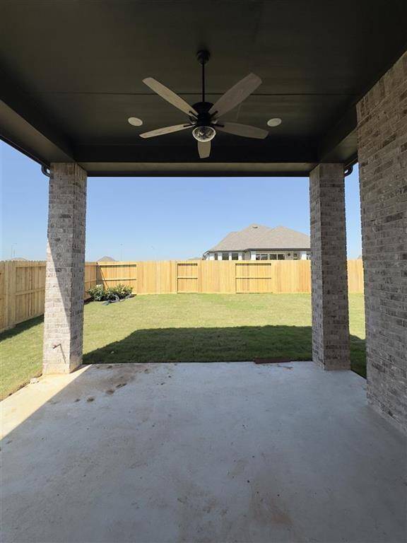 HOME IN PROGRESS - Enjoy year-round outdoor living on this spacious covered patio with a patio fan to keep you cool on warm days!