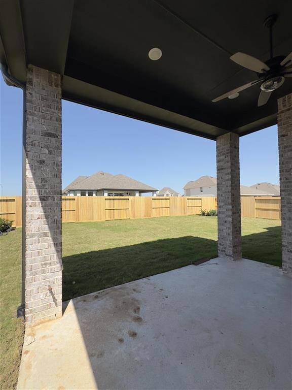 HOME IN PROGRESS - Enjoy year-round outdoor living on this spacious covered patio with a patio fan to keep you cool on warm days!