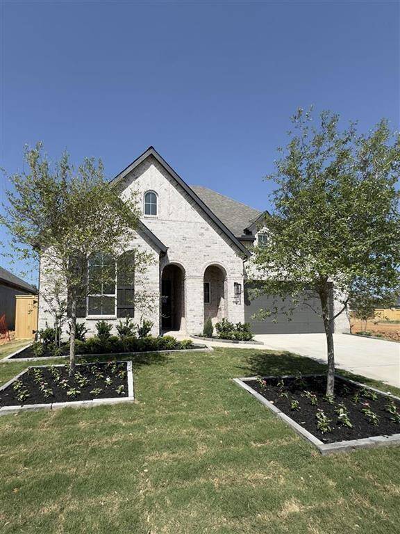 HOME IN PROGRESS - Stunning model floorplan with enhanced landscaping and stunning light-colored brick for standout curb appeal!