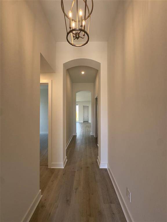 HOME IN PROGRESS - Welcoming grand entry way with soaring high ceilings and a bright chandelier!