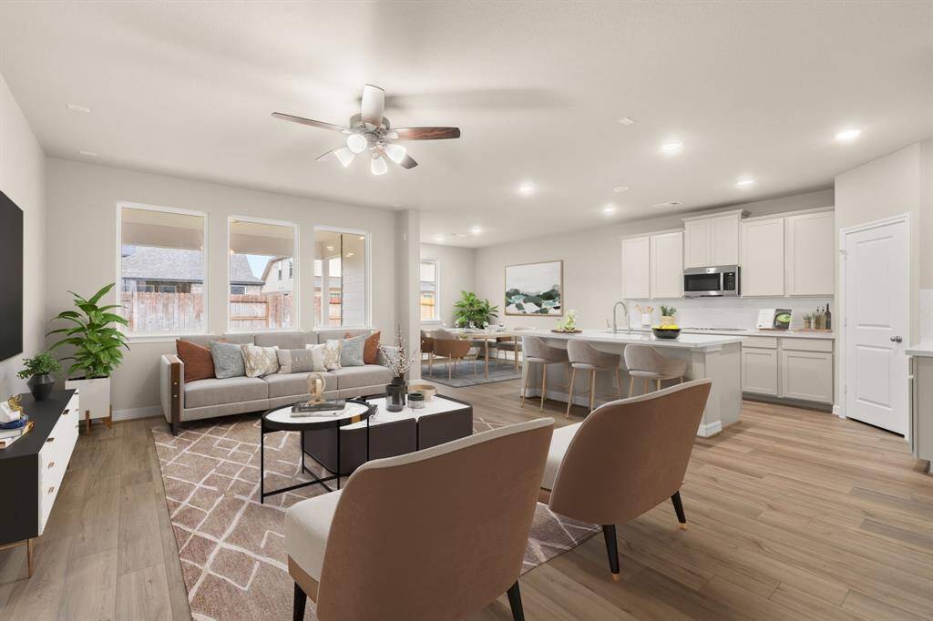 This home boasts a spacious open concept layout that combines the best of modern design and comfort for everyday living. Photo is virtually staged