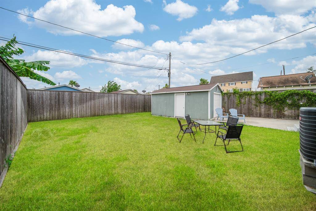 A sizable back yard provides ample space to design however you would like.