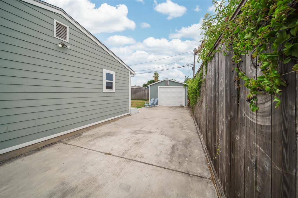 An extra long driveway allows for multiple cars to park.