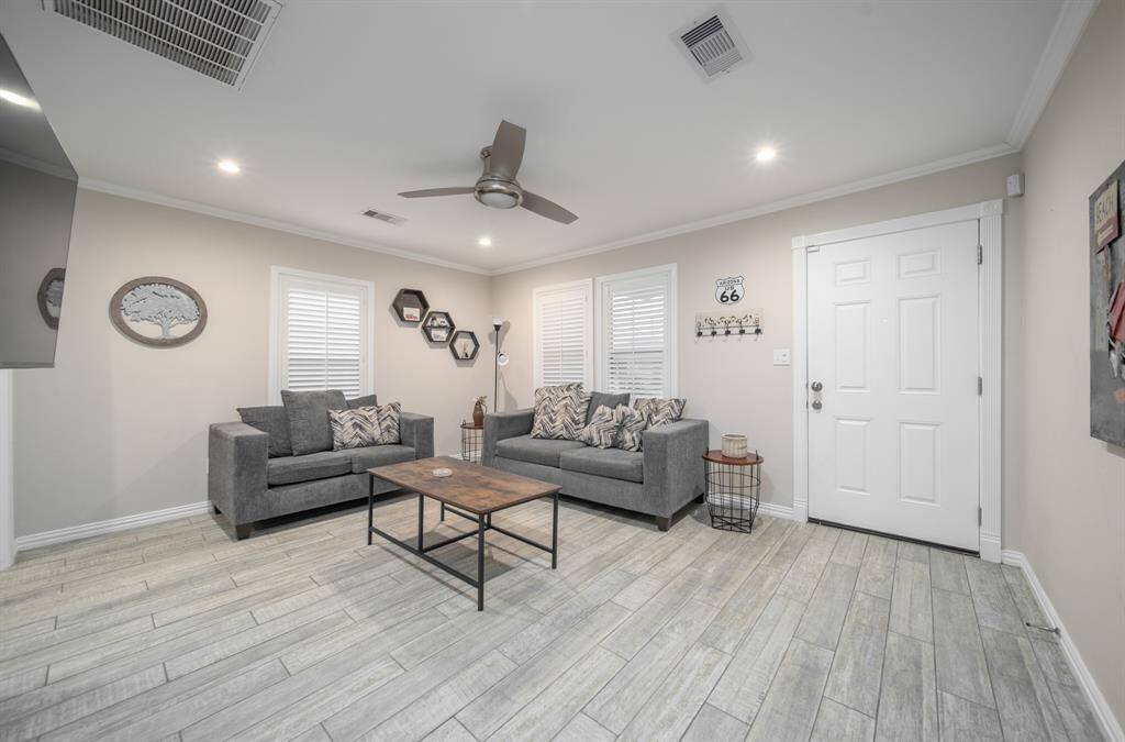 Step inside and not the wood plank flooring, just one of the features in this beautiful remodel.