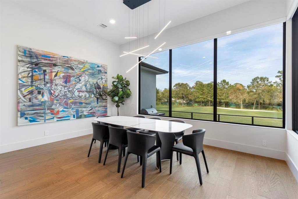 View of the dining room with a large wall to feature your artwork.