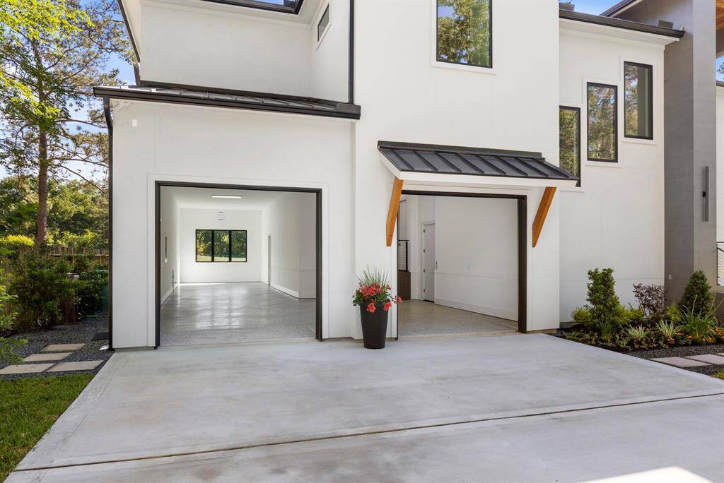 View of the garage from the driveway.  The grage features two 9' x 9' insulted garage doors.