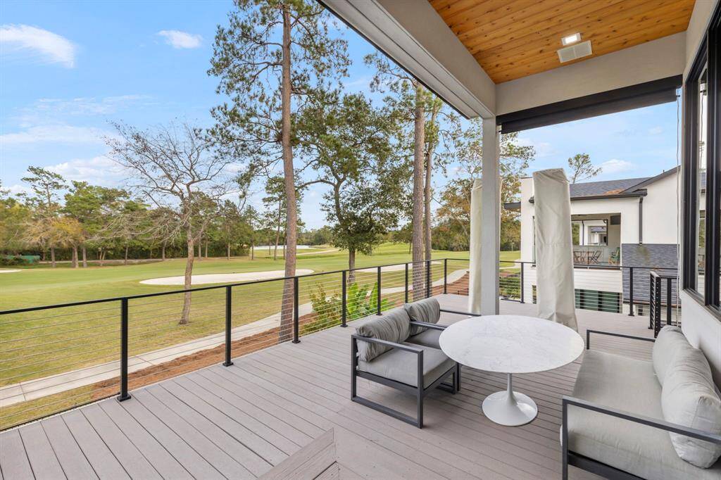 This home has over 1,200 sq ft of spacious patios with a panoramic eastern view of the 11th fairway of the TPC golf course. The area features a cedar ceiling with wiring for an outdoor TV if desired, Viewrail stainless rod with black post handrails, offer an open-air setting perfect for relaxation. The deck was lowered by approximately 20" so that the furniture does not block the golf course views from inside the home.
