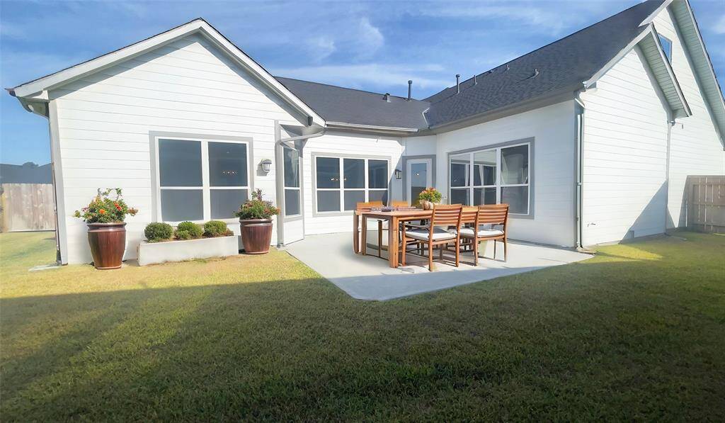 The Portico's courtyard serves as a private outdoor oasis, perfect for relaxing, entertaining, or enjoying serene moments surrounded by nature. *Image depicts similar floor plan in the community and is virtually staged.