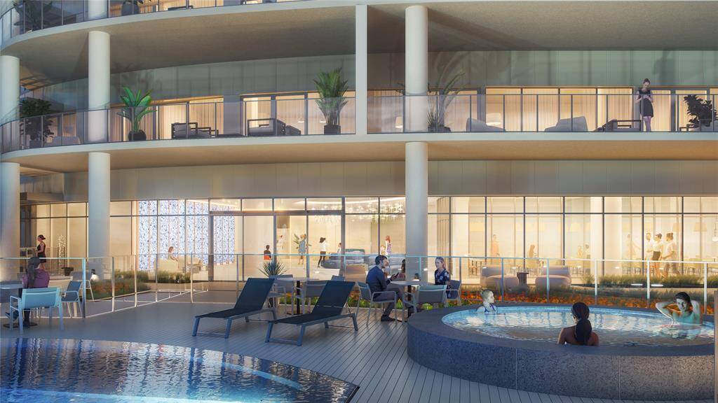 The Tiara outdoor amenity level features an inviting hot tub where you can melt away the cares of your day and watch the moonlight dance along the surface of our infinity edge pool.