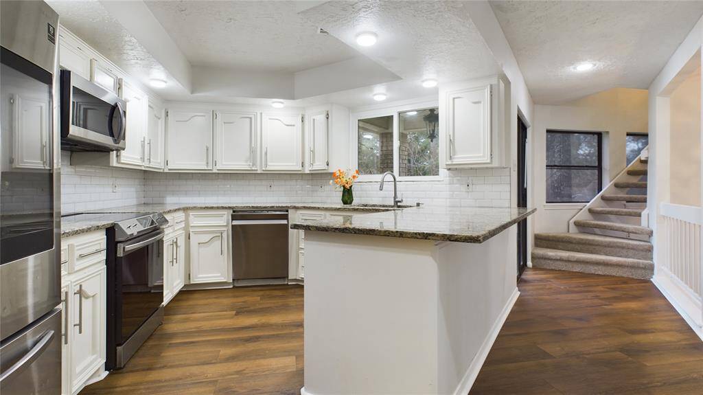 Gorgeous Kitchen! The Window by sink is stunning views of your very large backyard with huge trees!
