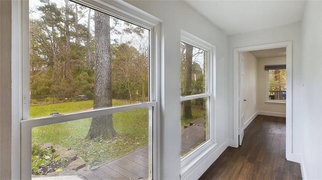 Hallway to Primary Bedroom!! Gorgeous tree views lovely windows!