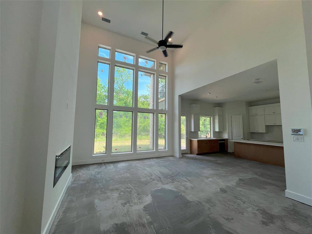 Wall of windows at family room provides tons of natural light