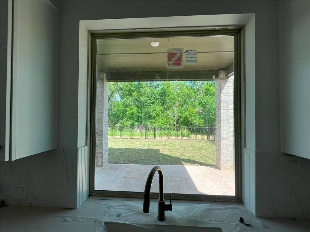 Sink with a view of your greenbelt lot!