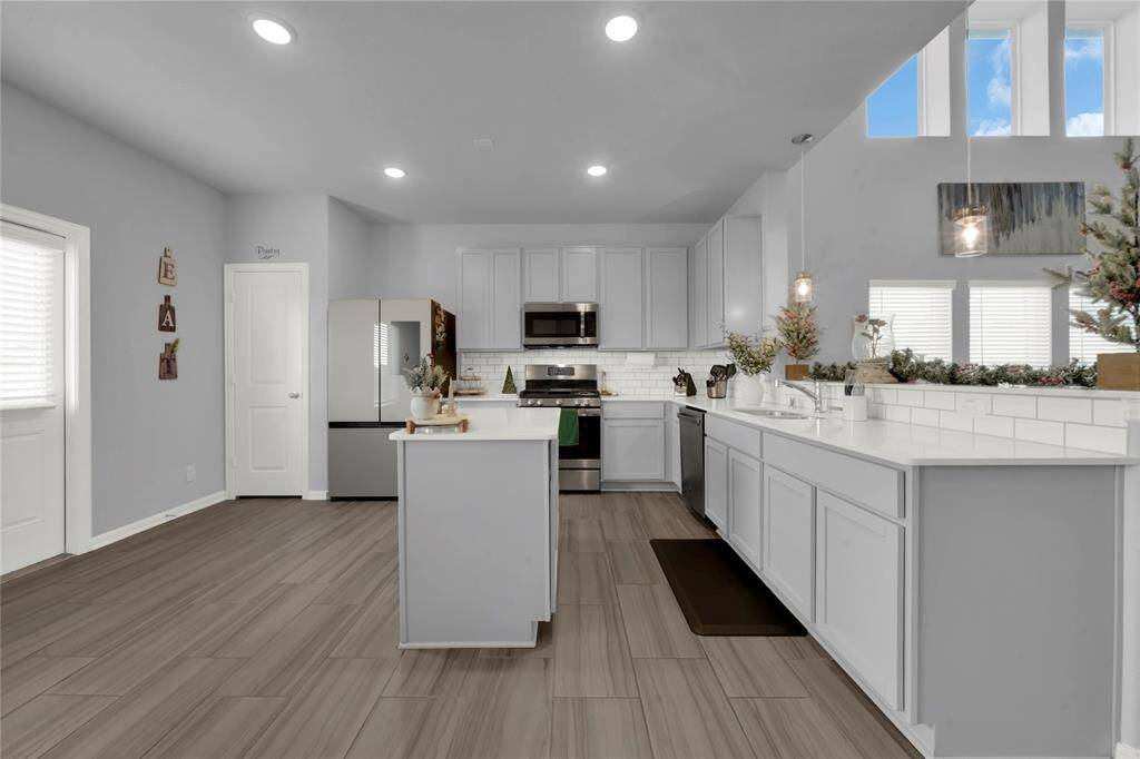 Luxurious ensuite with a deep soaking tub, separate shower, and spacious walk-in closet.