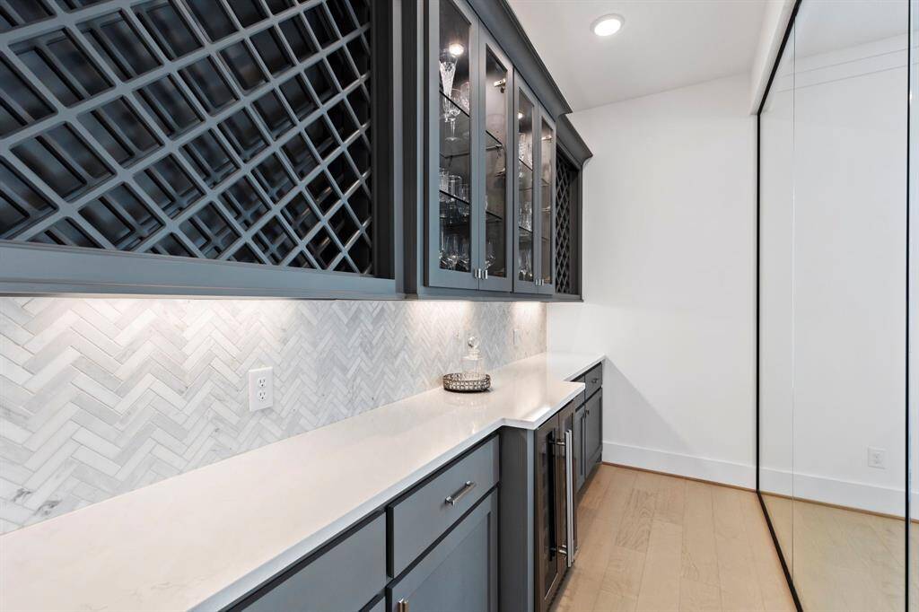 Perfect space to showcase your special wines with plenty of storage and beverage refrigerator.